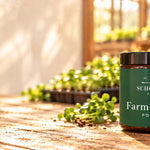 Farm Greens powder and capsules on the farm table